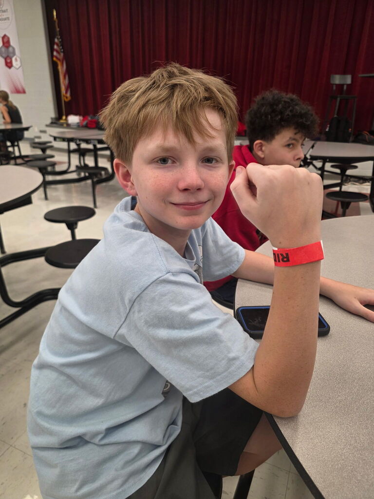 Students pose with their Grape and Fall Festival wristbands!