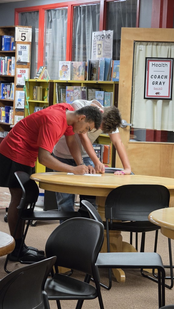 9th grade students visit the high school library.