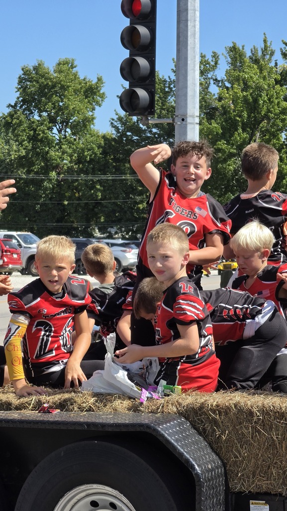 Students throw candy at the parade.