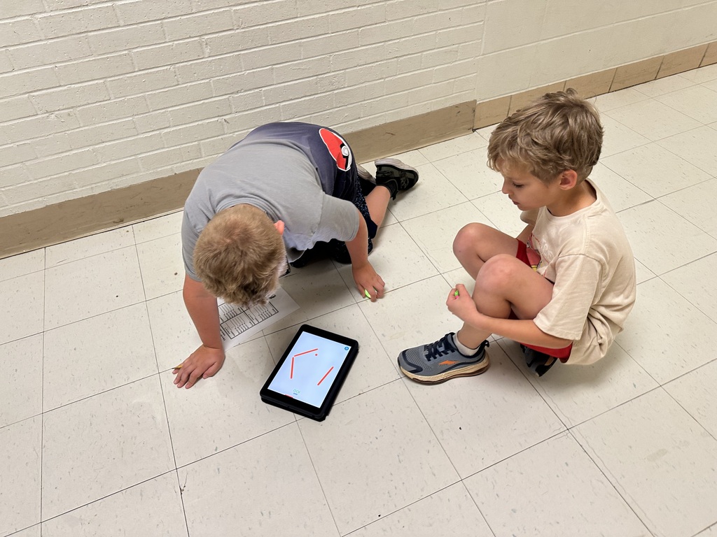 Robotics Club programs Spheros for a challenge.