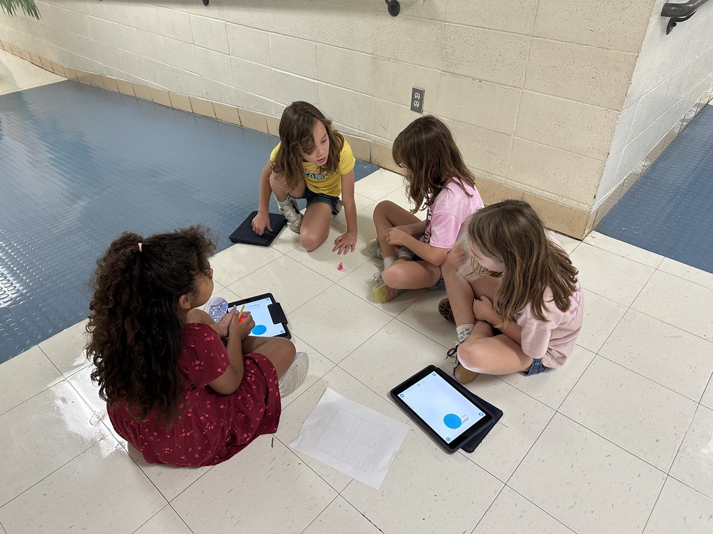 Robotics Club programs Spheros for a challenge.