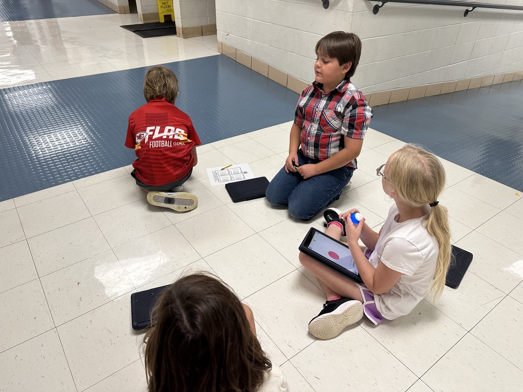 Robotics Club programs Spheros for a challenge.