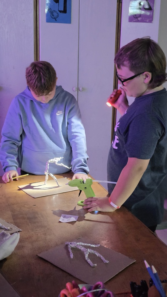 Fifth grade students work in art class on sculptures.