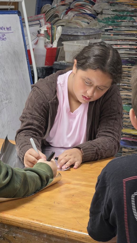 Fifth grade students work in art class on sculptures.