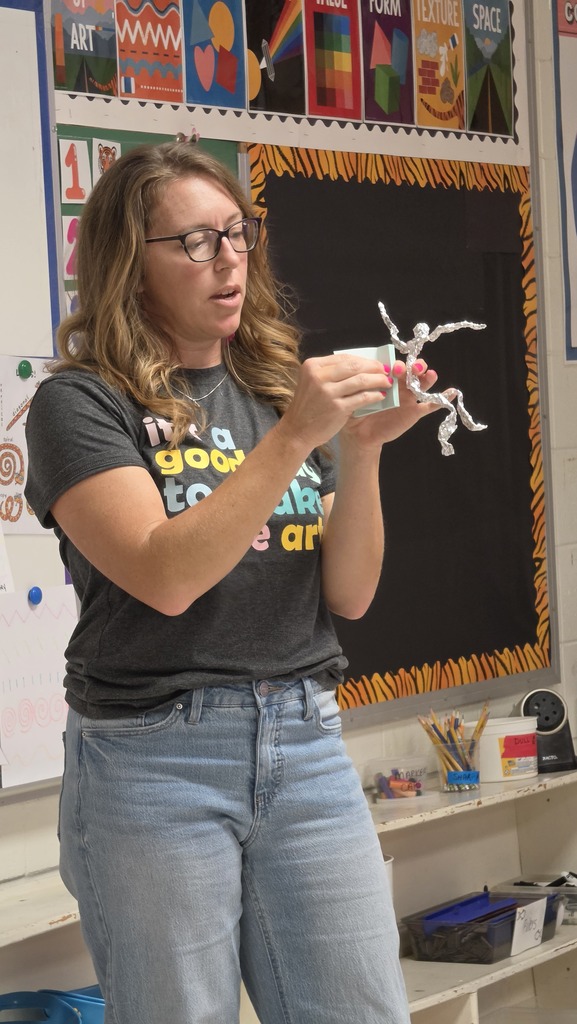 Fifth grade students work in art class on sculptures.