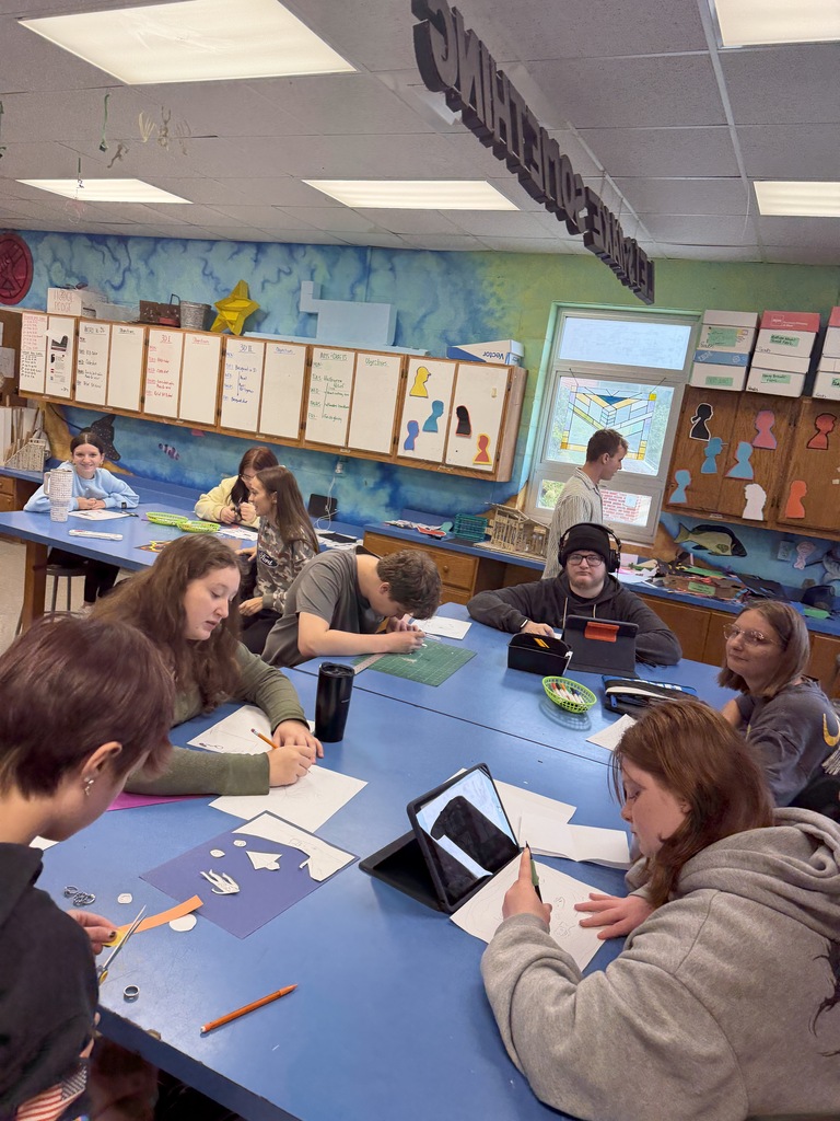 Students create three dimensional art at the high school. 