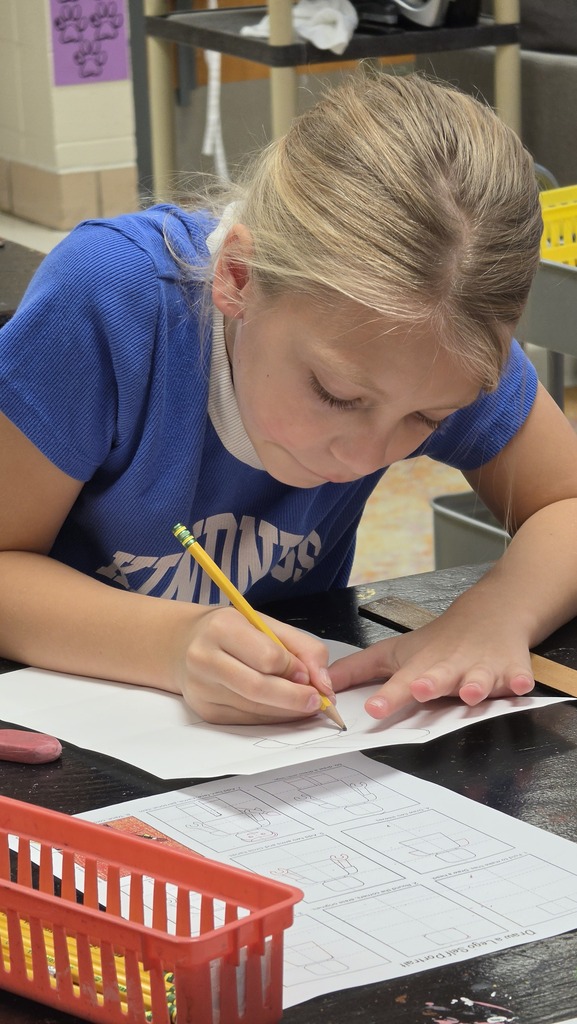 Fourth grade students create LEGO self-portraits.