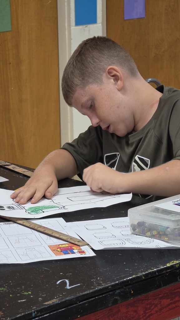 Fourth grade students create LEGO self-portraits.