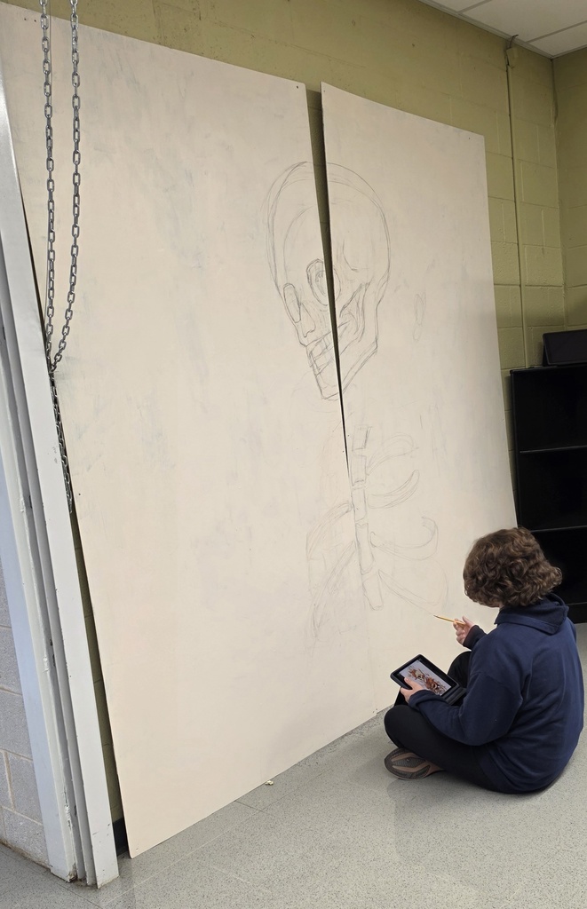 Advanced art students create props for the Red Regiment's show.