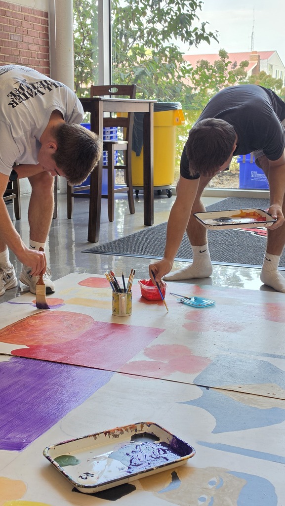 Advanced art students create props for the Red Regiment's show.