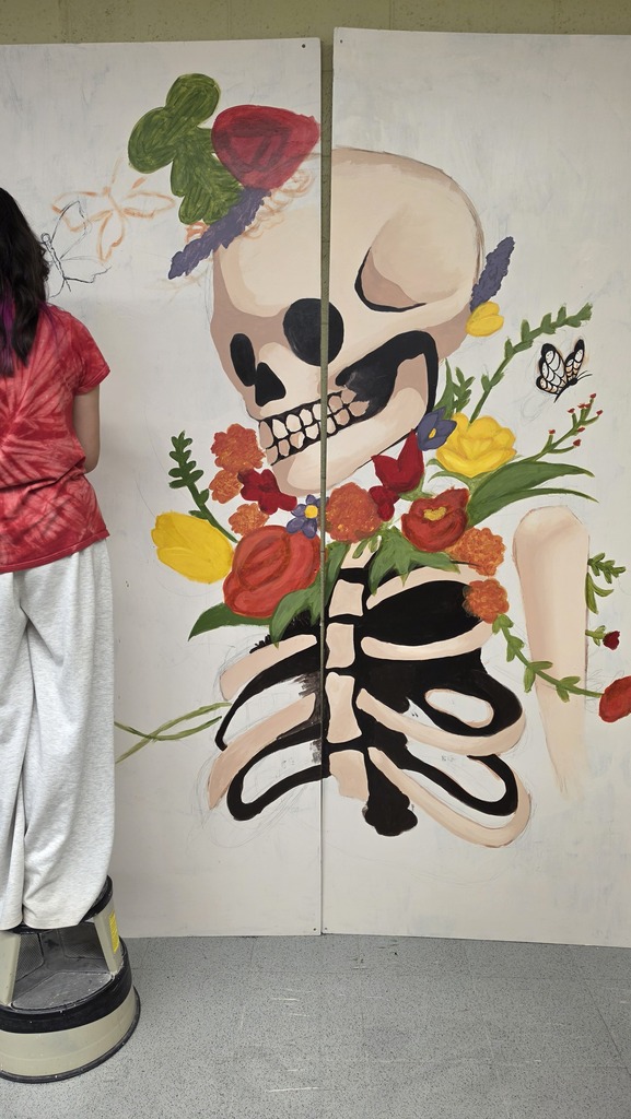 Advanced art students create props for the Red Regiment's show.