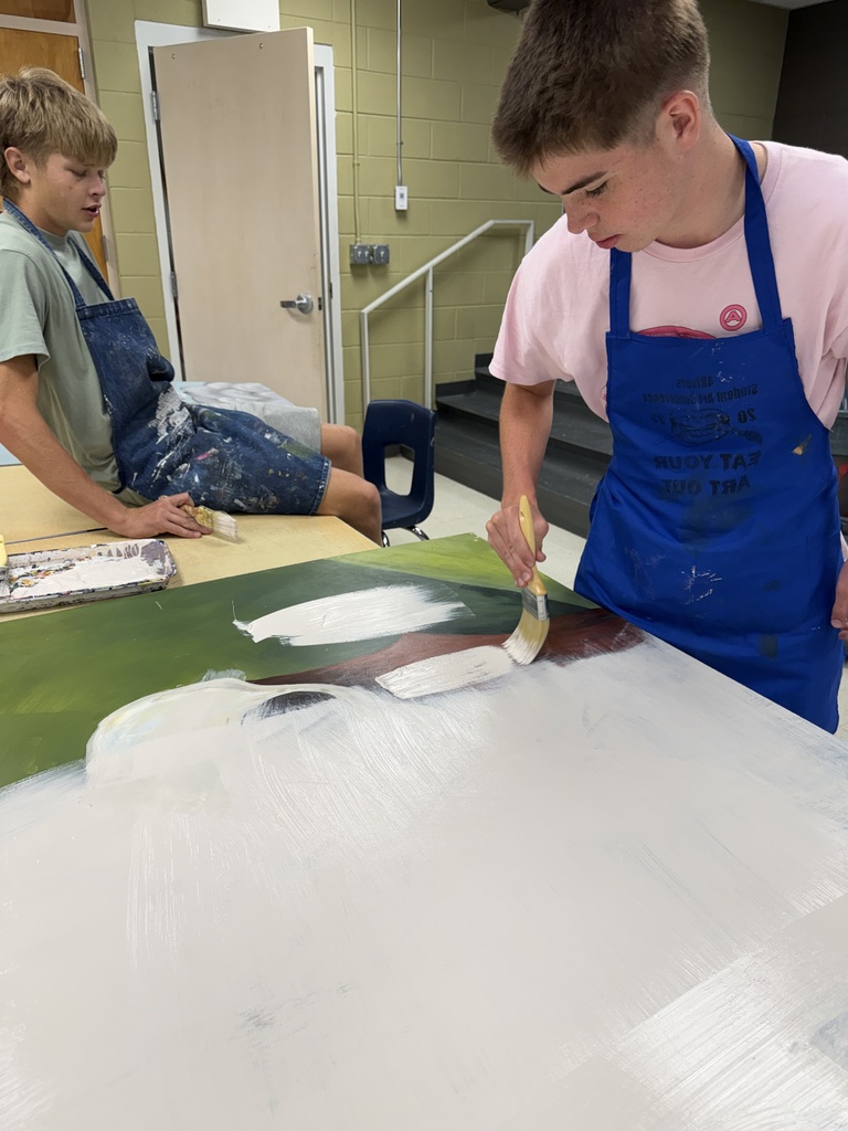 Advanced art students create props for the Red Regiment's show.