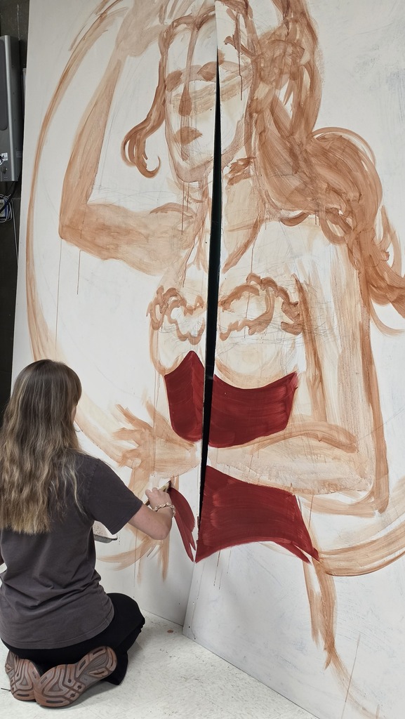 Advanced art students create props for the Red Regiment's show.
