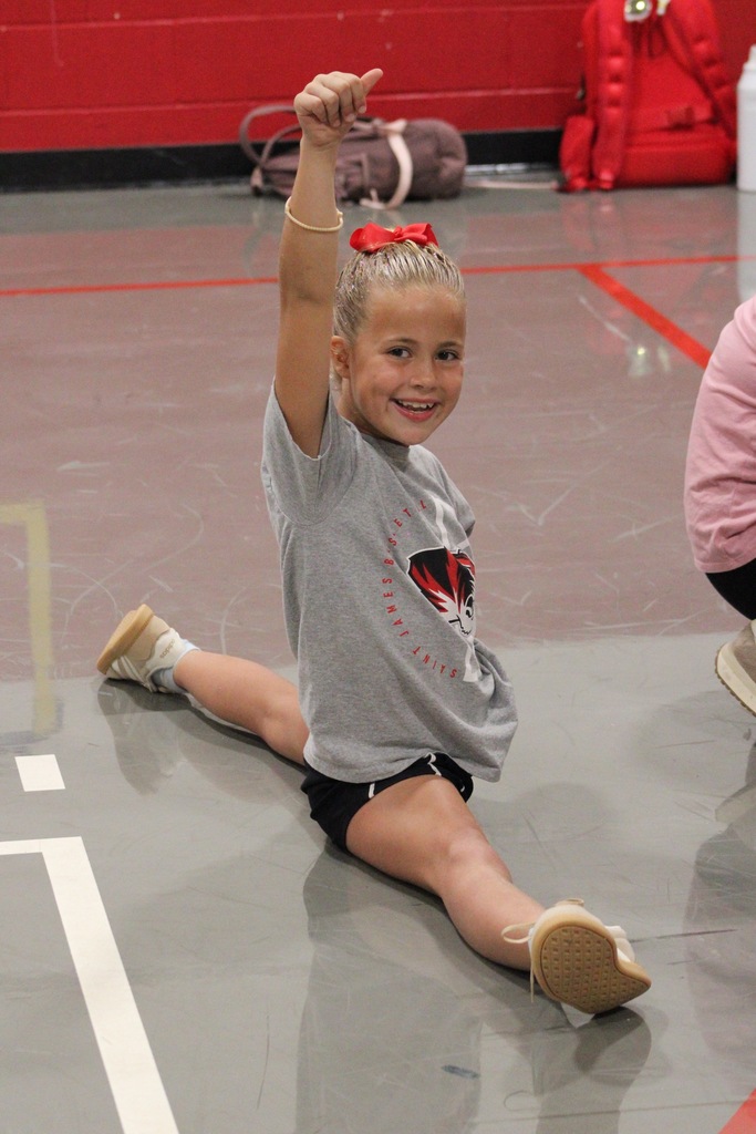 Cheer camp showcases Social Integrity through mentorship. 