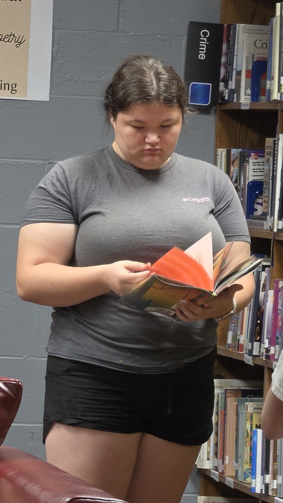 Creative writing students visit the library for a lesson about short form writing.
