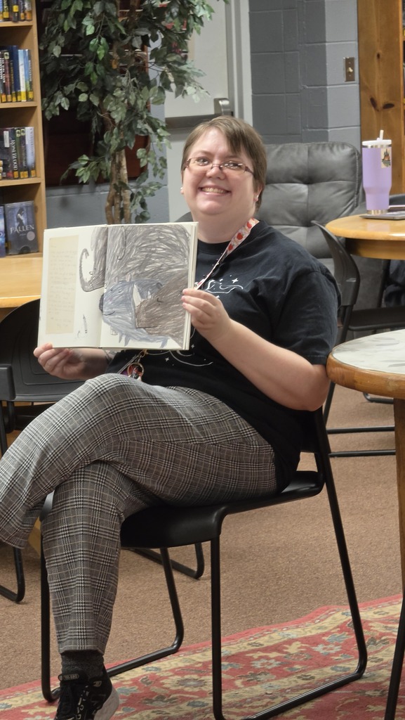 Creative writing students visit the library for a lesson about short form writing.