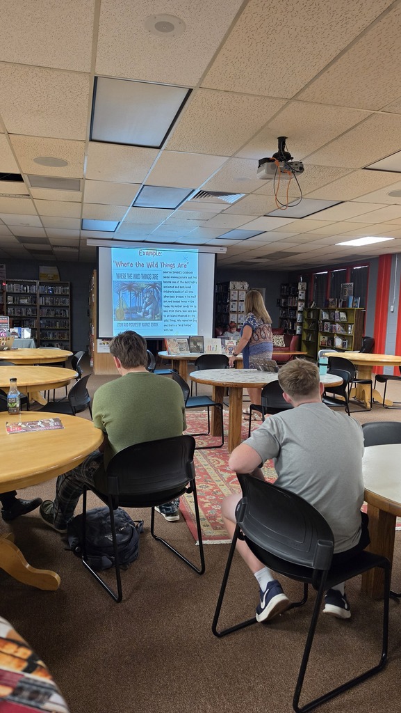 Creative writing students visit the library for a lesson about short form writing.