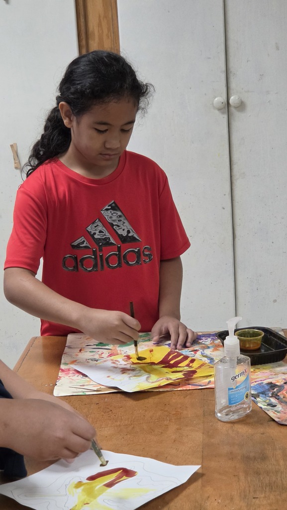 LWJE artists use "invisible" ink to create fall paintings.
