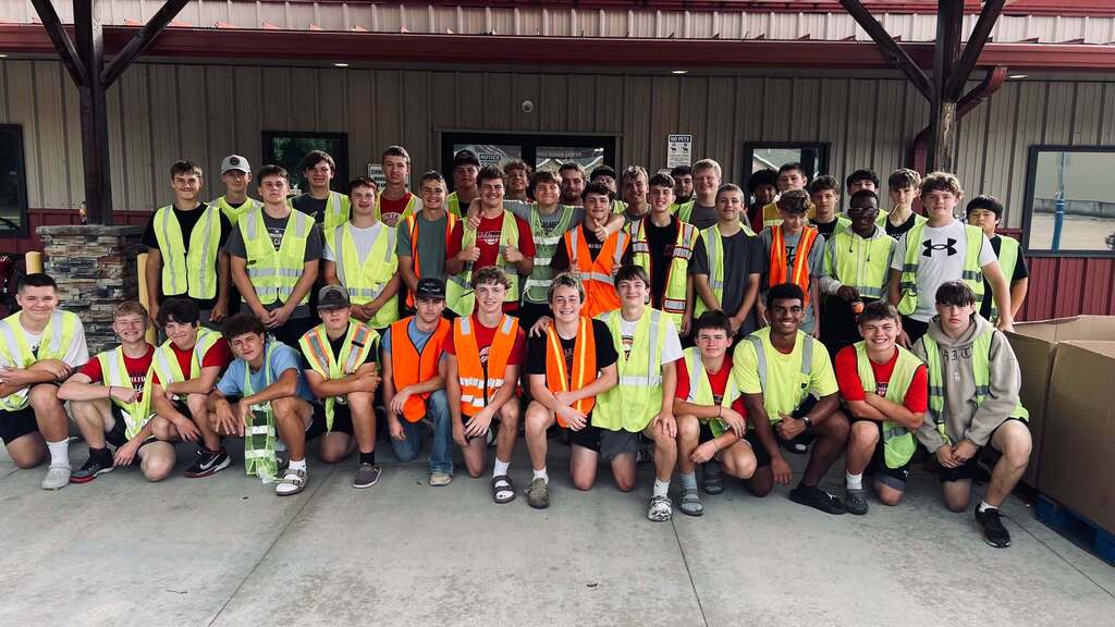 St. James Football volunteers at Commodity Distribution.