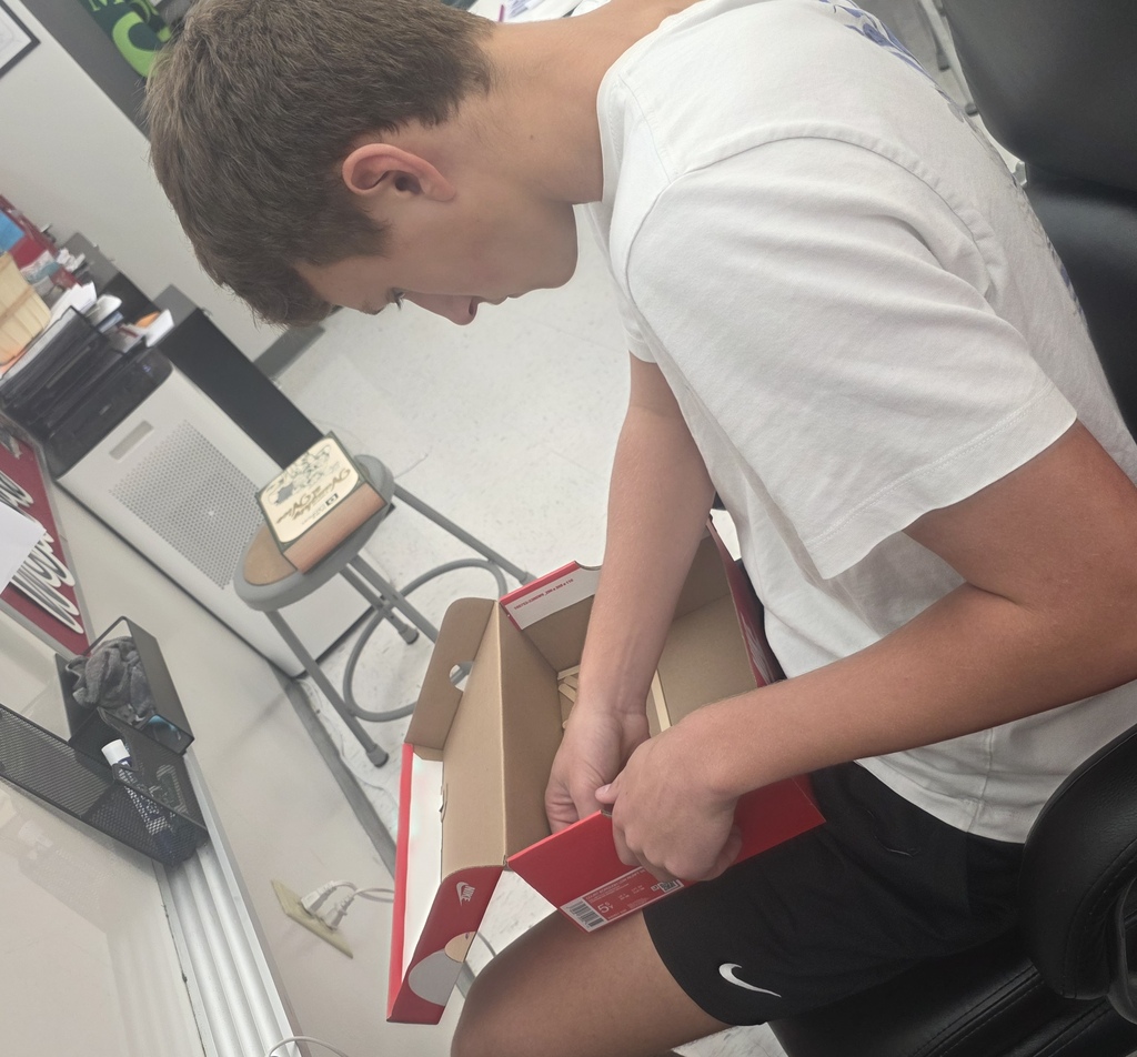 Middle school agriculture students build models to display their research.