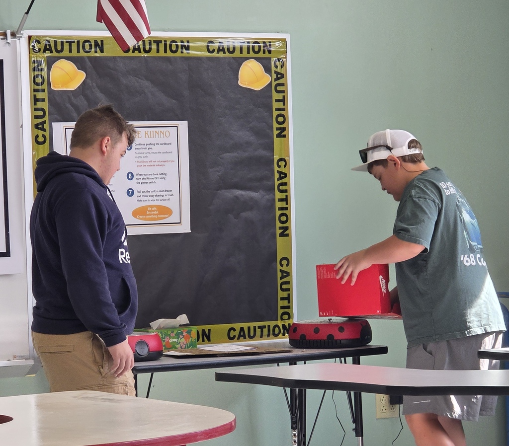 Middle school agriculture students build models to display their research.
