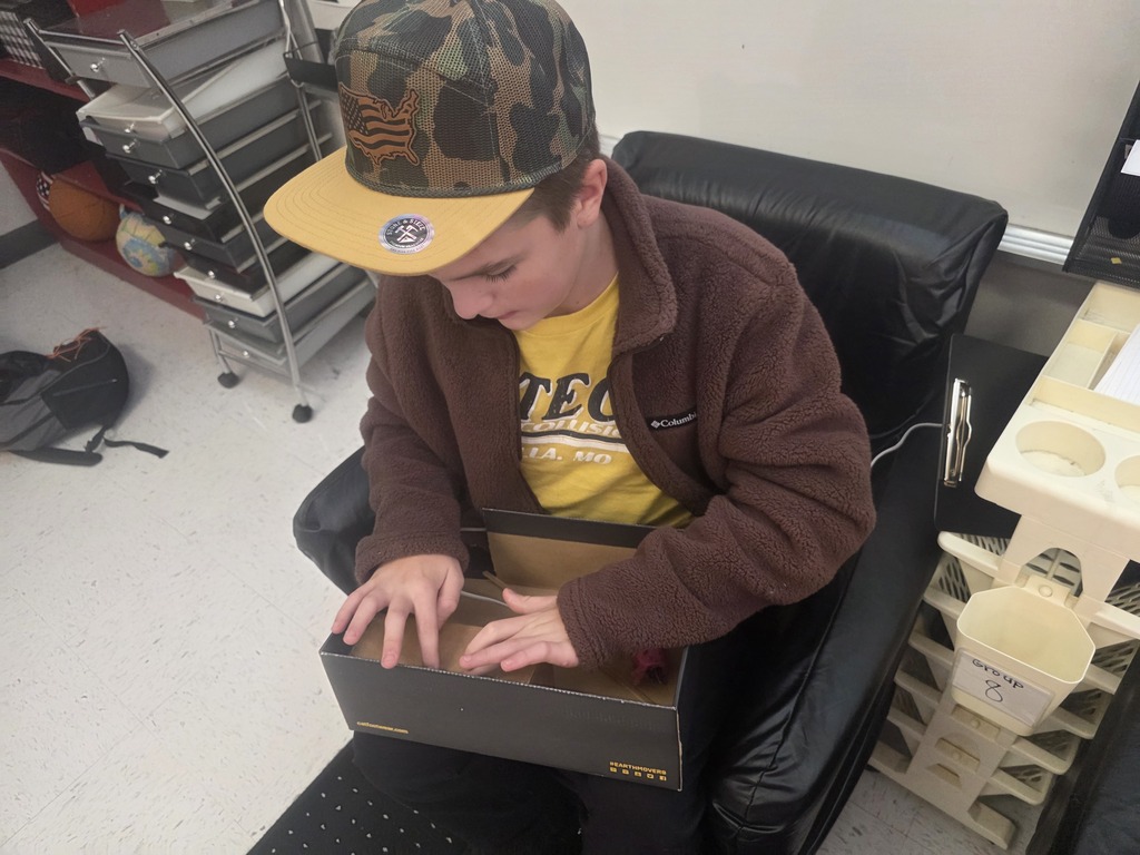 Middle school agriculture students build models to display their research.
