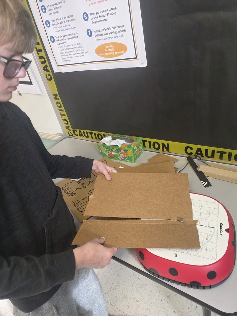 Middle school agriculture students build models to display their research.
