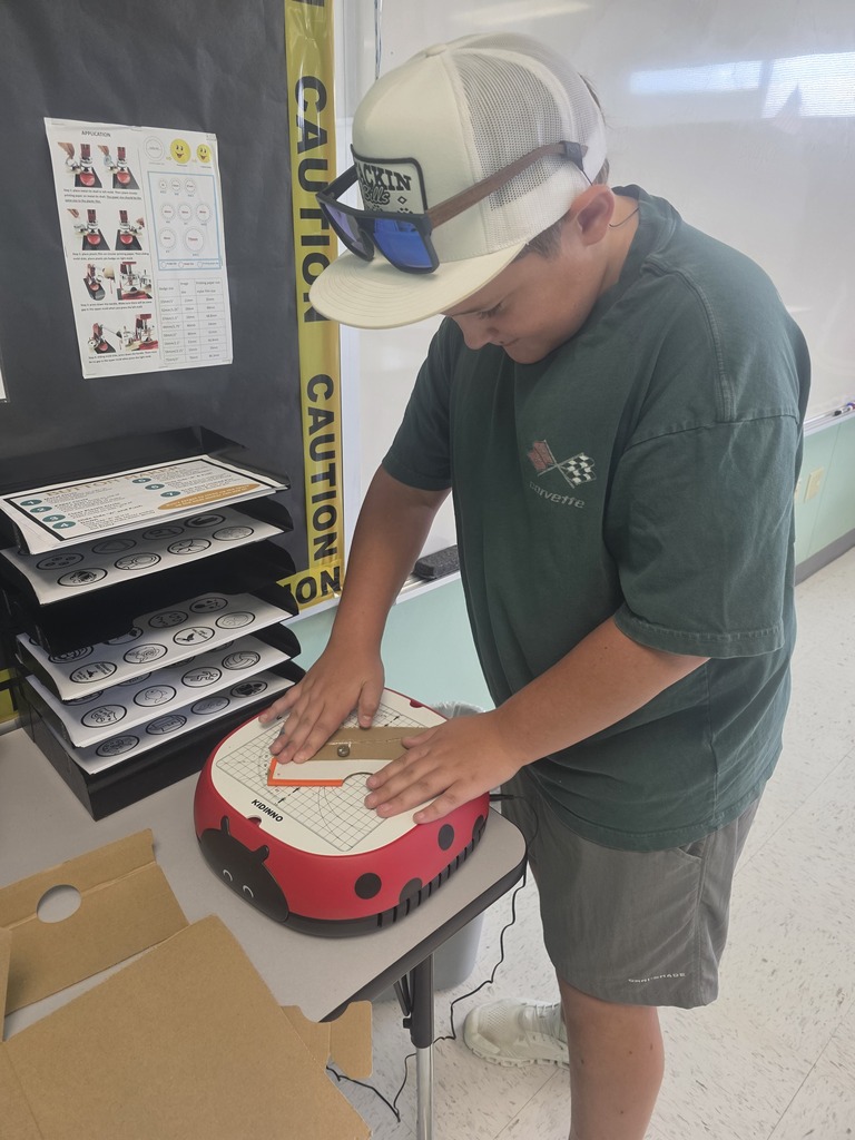 Middle school agriculture students build models to display their research.