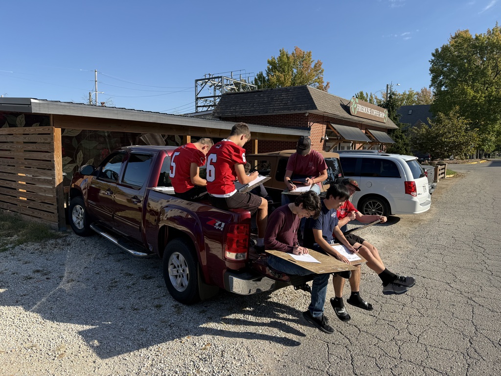 High school artists enjoy the Fall weather while sketching their design for Inktober.