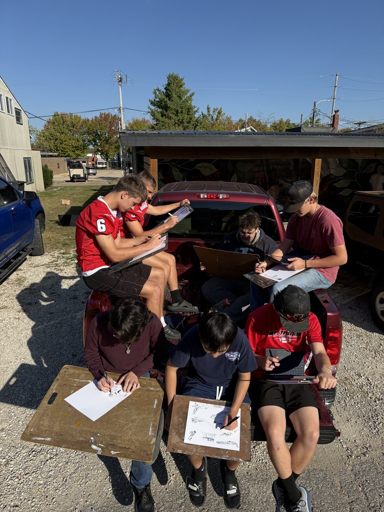 High school artists enjoy the Fall weather while sketching their design for Inktober.