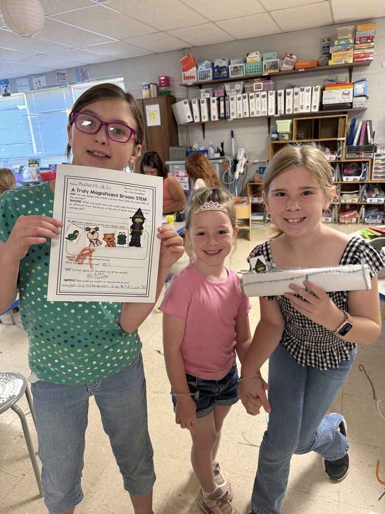 Fifth-grade students help kindergarten students build their own brooms during a Halloween-themed STEM challenge after reading Room on the Broom.