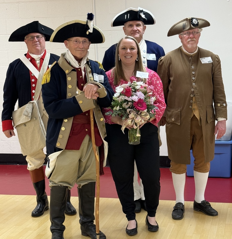 Moreland posed with men getting her award