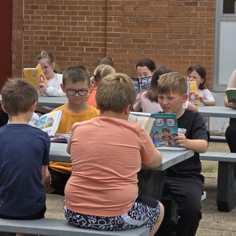 Class reading at table
