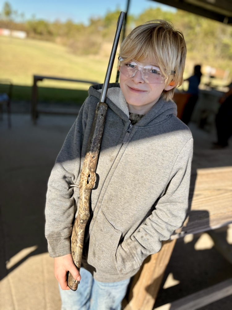 4H members, Blaise B., Tate Y., and Randi K. attended shooting sports practice. Members practiced rifle, shotgun, and archery sports. By: Reporter, Randi K.