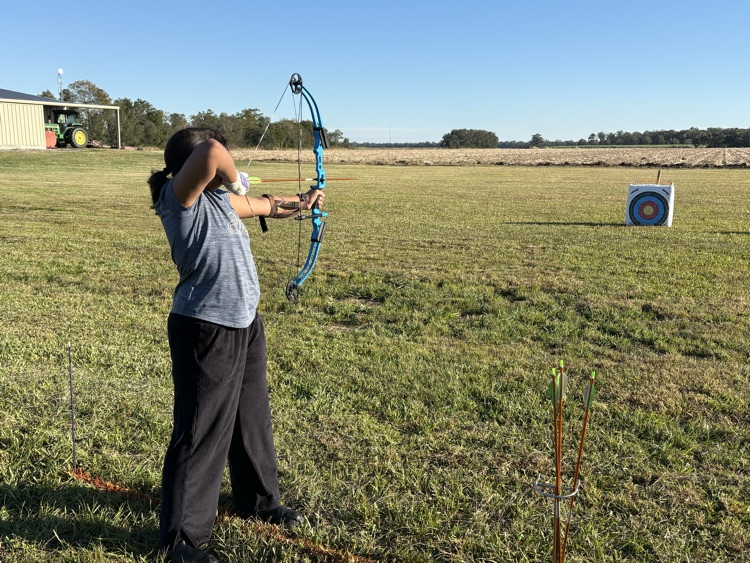 4H members, Blaise B., Tate Y., and Randi K. attended shooting sports practice. Members practiced rifle, shotgun, and archery sports. By: Reporter, Randi K.