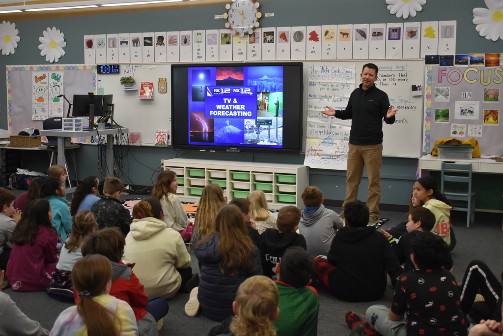 Mark Nelsen visiting the elementary to talk about his meteorologist job