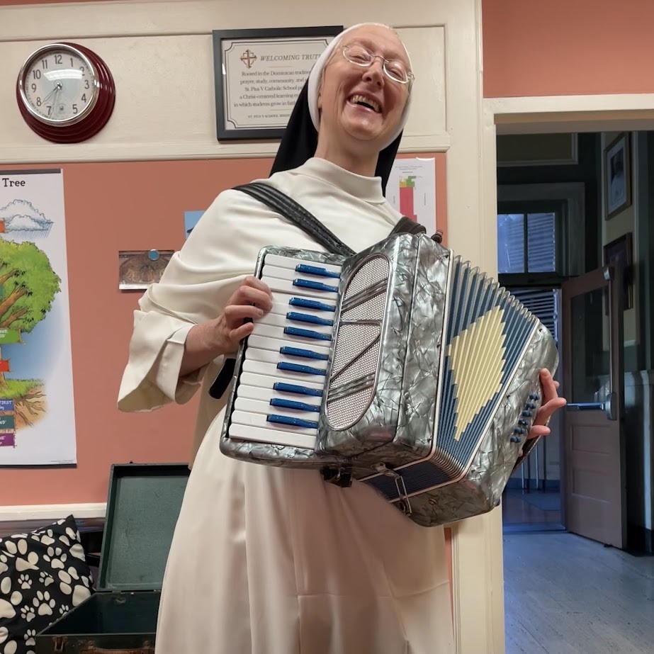 Sister playing the accordion