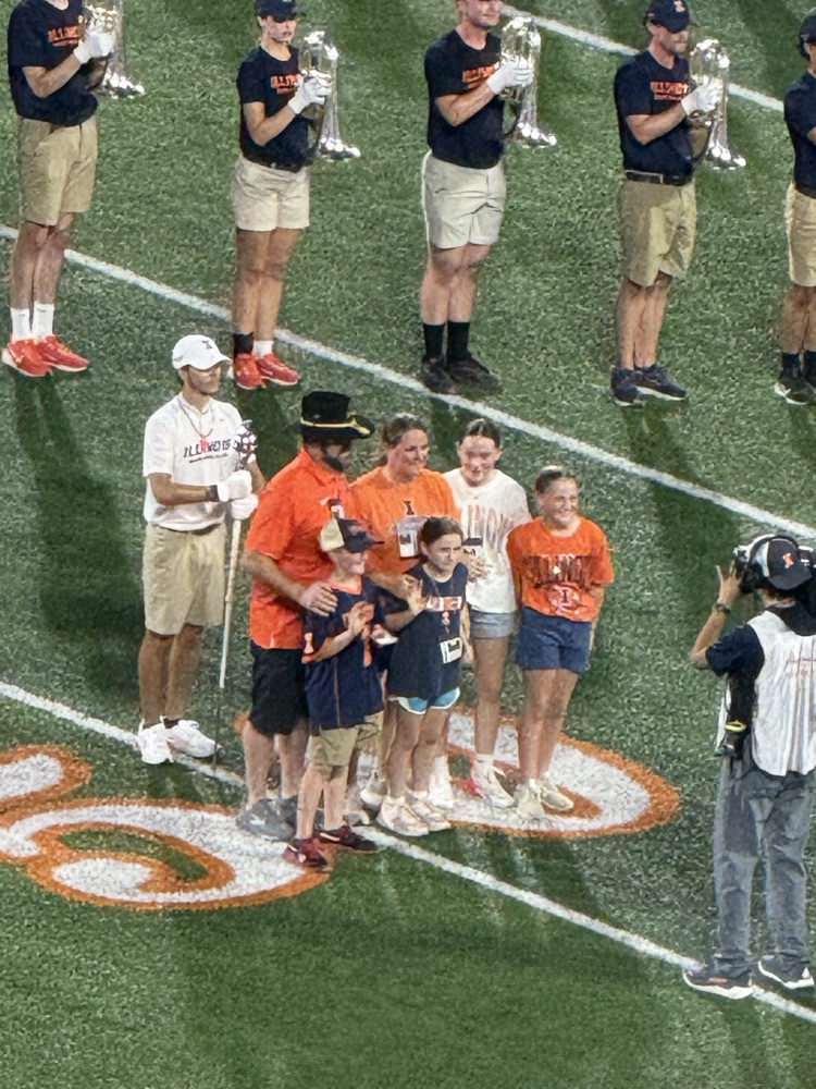 Kampmueller family on the U of I football field.