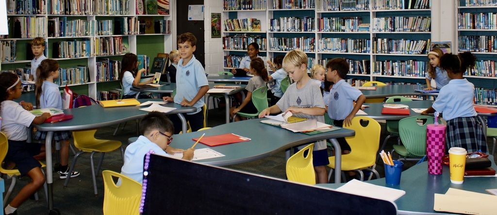 Children in aftercare doing homework.