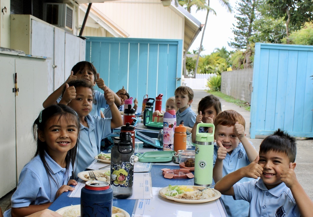 Students enjoying school lunch.