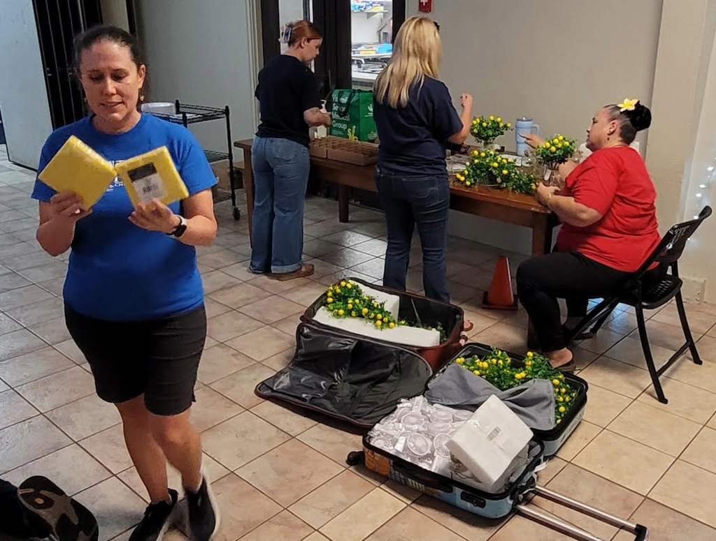 Working together to prepare for CSW Dinner and Auction night