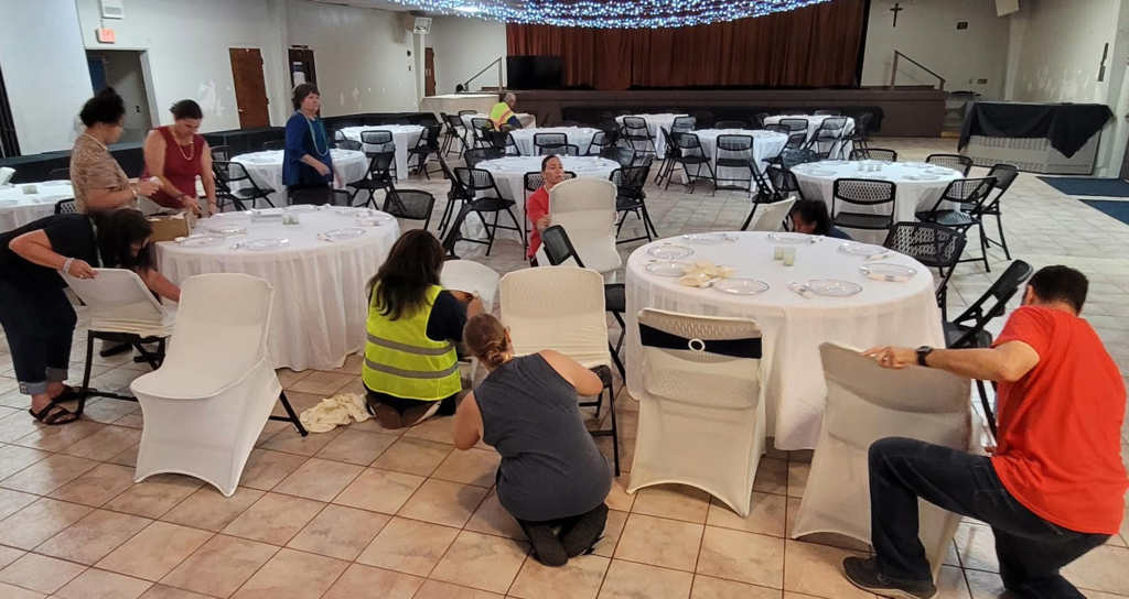 The SAS staff working on preparing the hall for CSW Dinner and Auction.