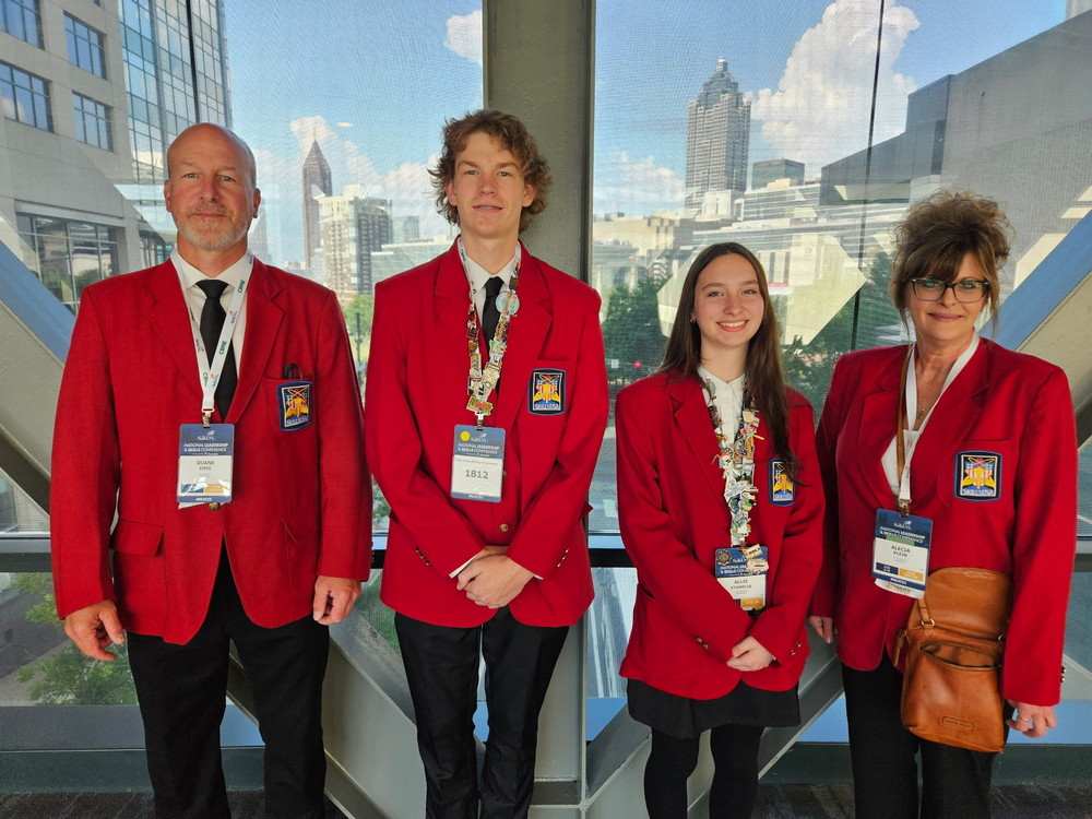TEC instructor Duane Emig (left) and Alecia Klein (right) celebrate with students Lucas Bauman and Allane Stamplis at the national SkillsUSA Competition in Atlanta, GA. Bauman finished 4th in the nation in CNC 5-Axis Milling Programming.