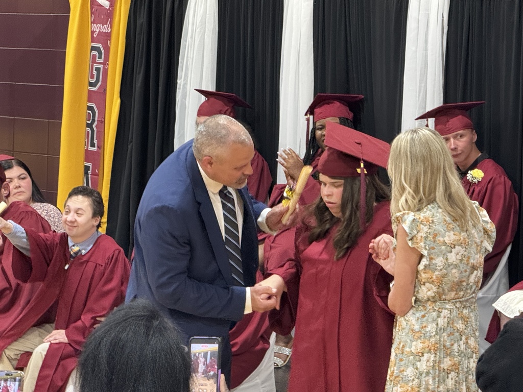 Ethan Barden shakes hands with a Woodland student