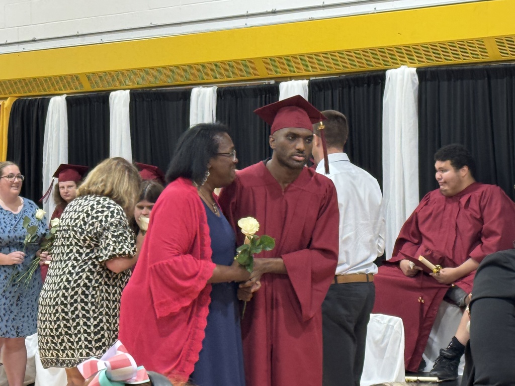 A family celebrates at the completion ceremony