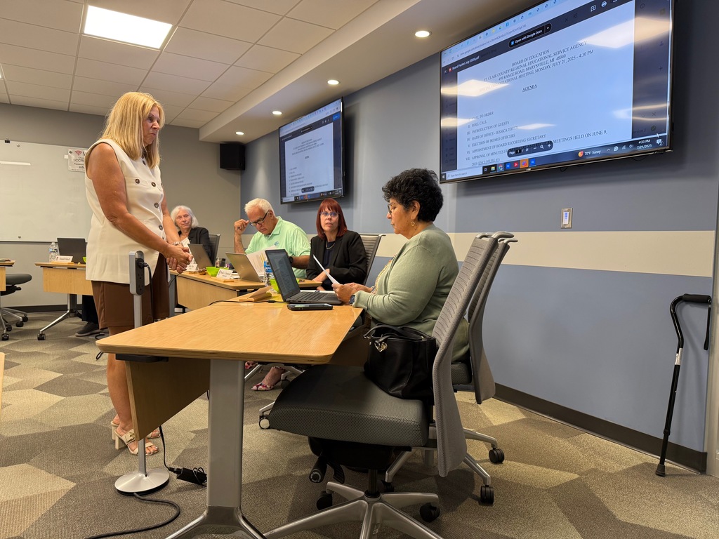 Jessica Totty is sworn in as the newest member of the St. Clair County RESA Board of Education by recording secretary Kris Murphy at the July 21 board meeting.