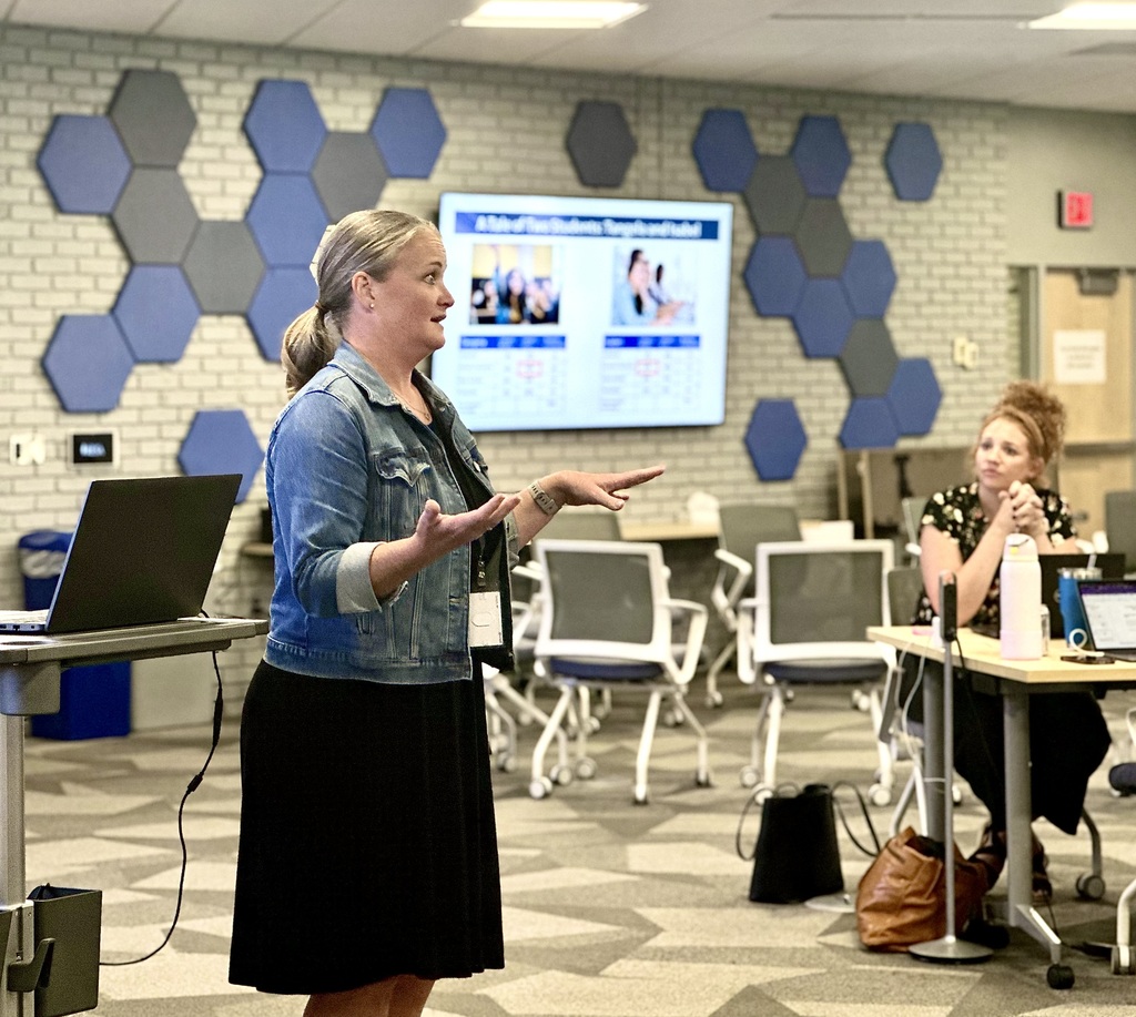 A presenter speaks to a conference of educators during the Second Shift Academy workshop