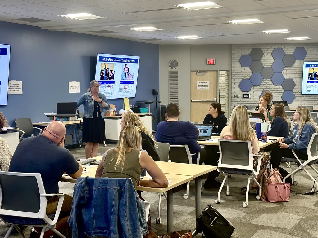 A presenter speaks to a conference of educators during the Second Shift Academy workshop