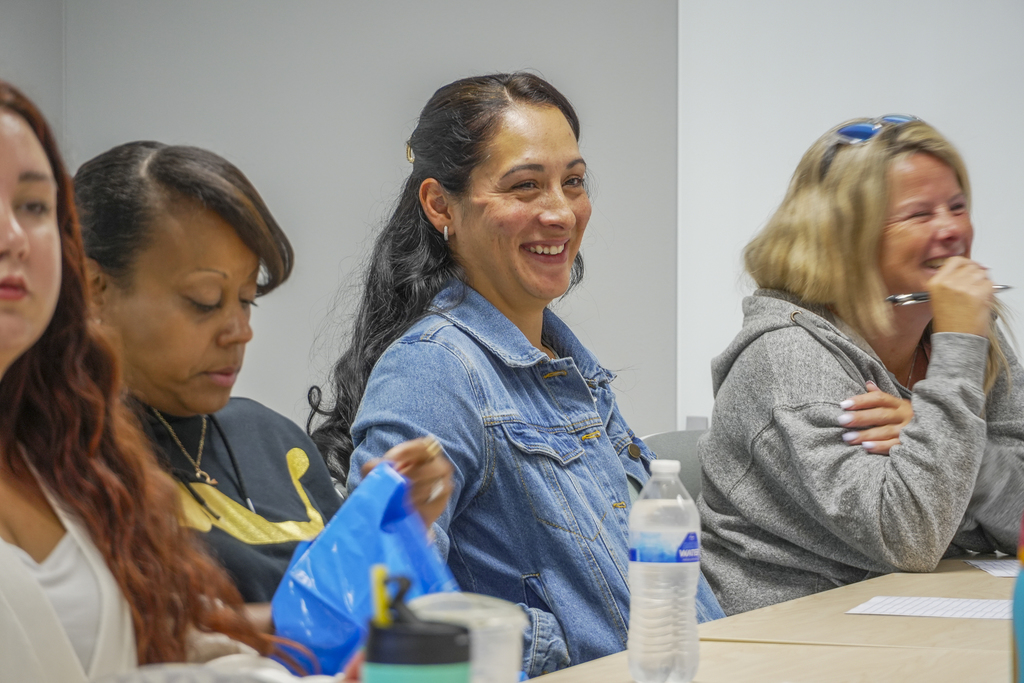 Smiling woman sitting at a table