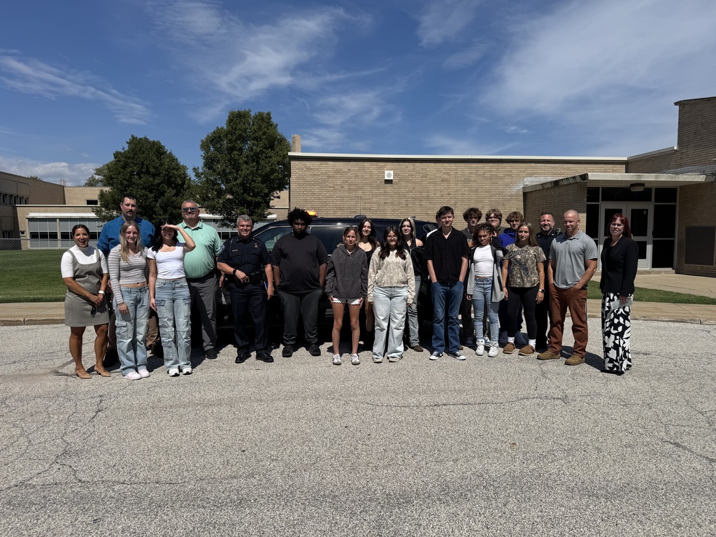 Representatives from St. Clair TEC, St. Clair County RESA, the Port Huron Police Department, Port Huron Schools,  and students enrolled in the Law & Public Safety Program stand in front of the newly donated retired police cruiser